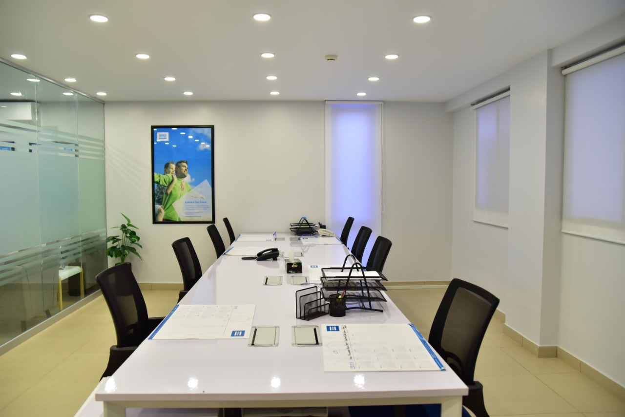 Meeting room with glass partition and brand artwork