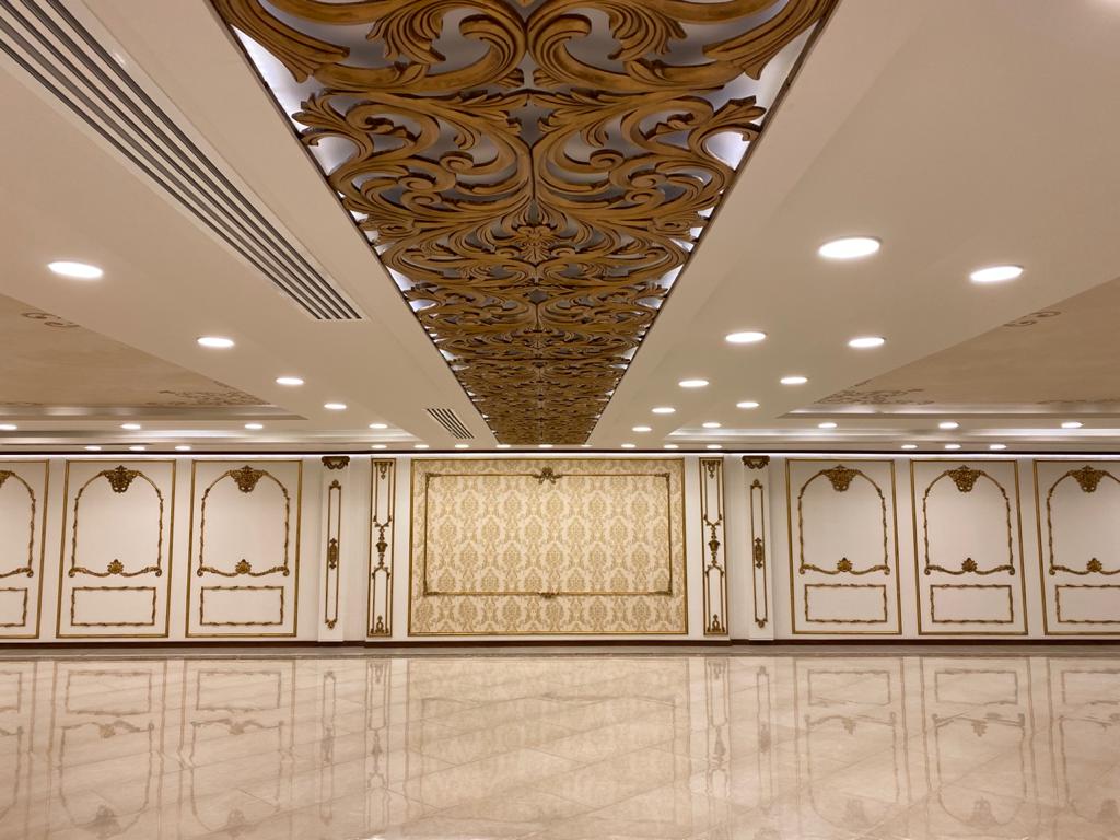 Classical panelled hall with a carved timber ceiling feature
