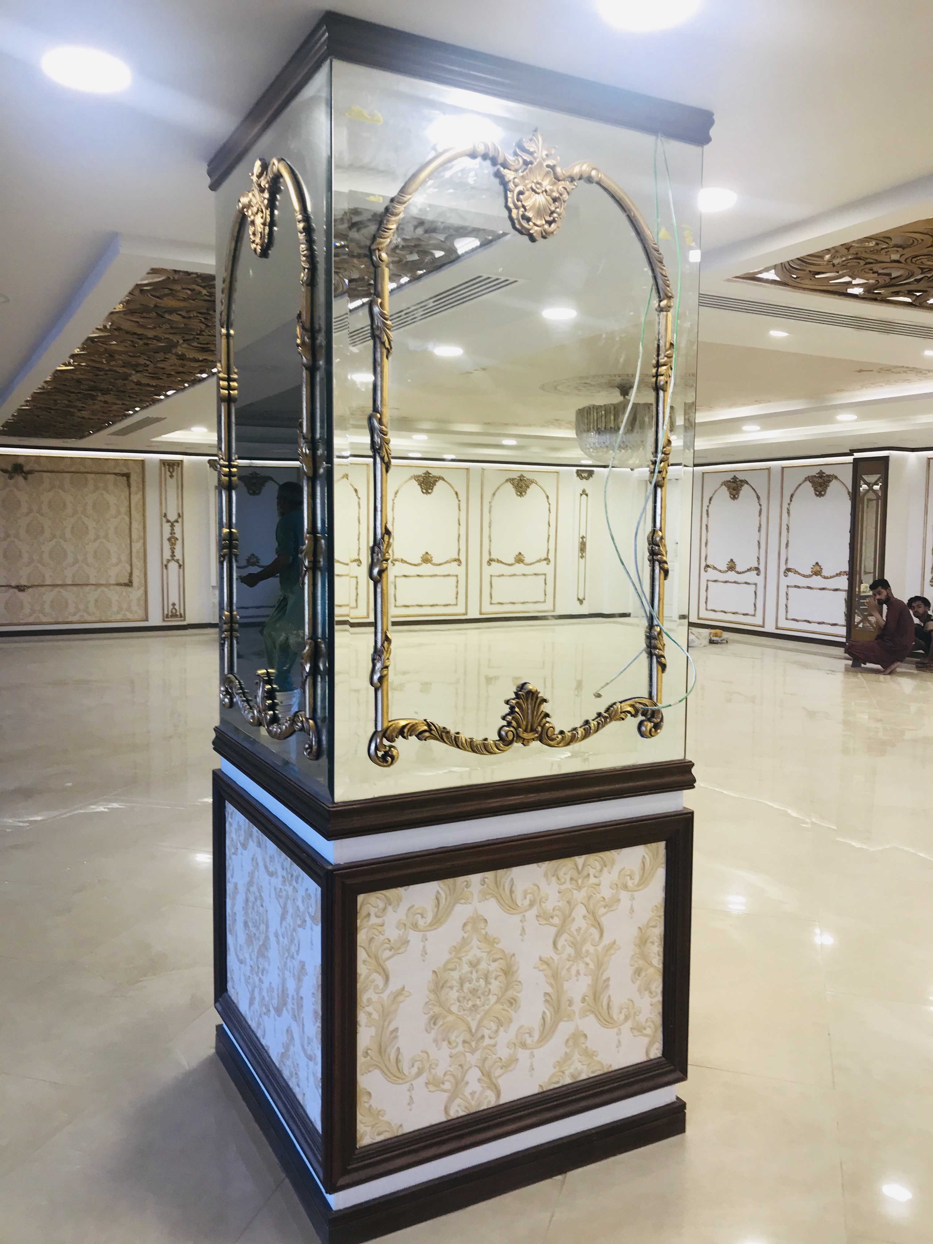 Mirrored gold-trimmed column detail