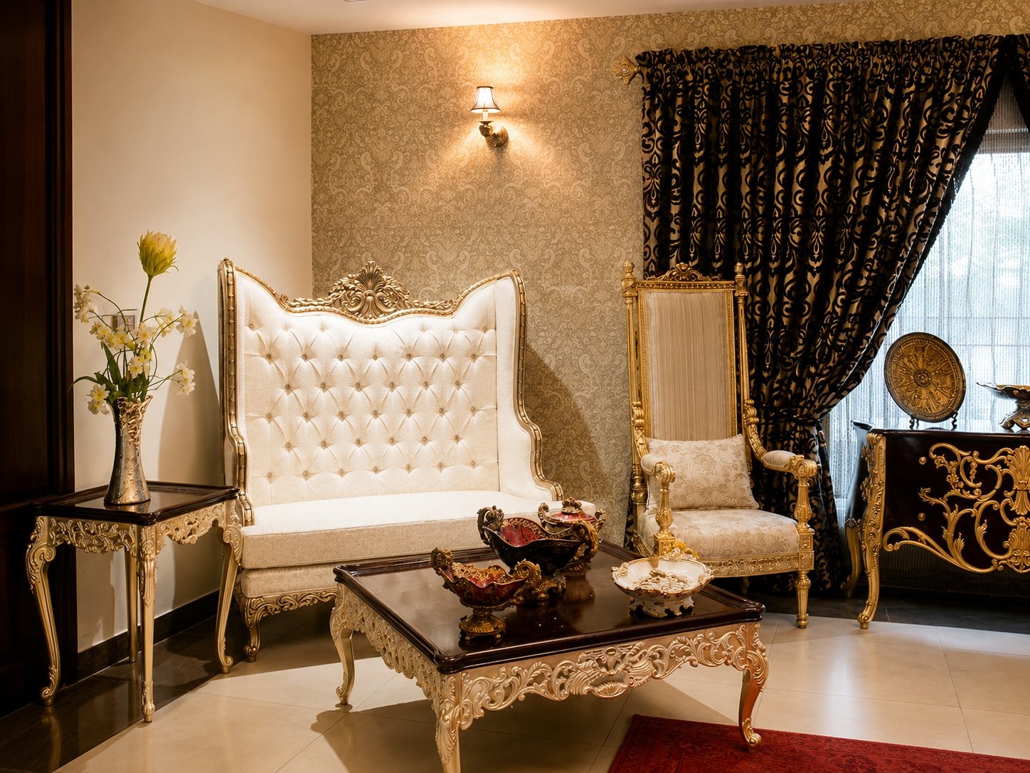 Drawing room with a white-and-gold tufted settee and gilded throne chair
