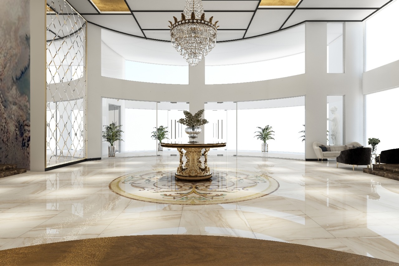 Circular rotunda with a crystal chandelier and gold pedestal table