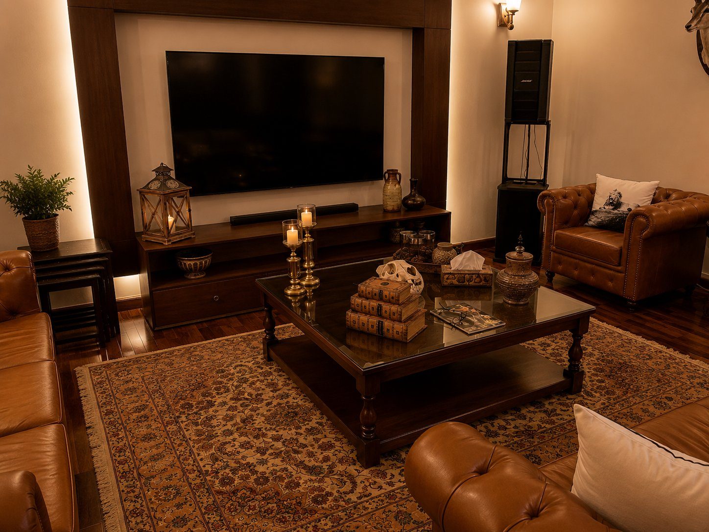 Dark wood media console with leather armchairs and Persian rug
