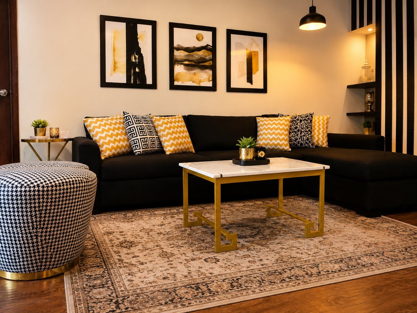 Black and gold living room with chevron coffee table and houndstooth ottoman