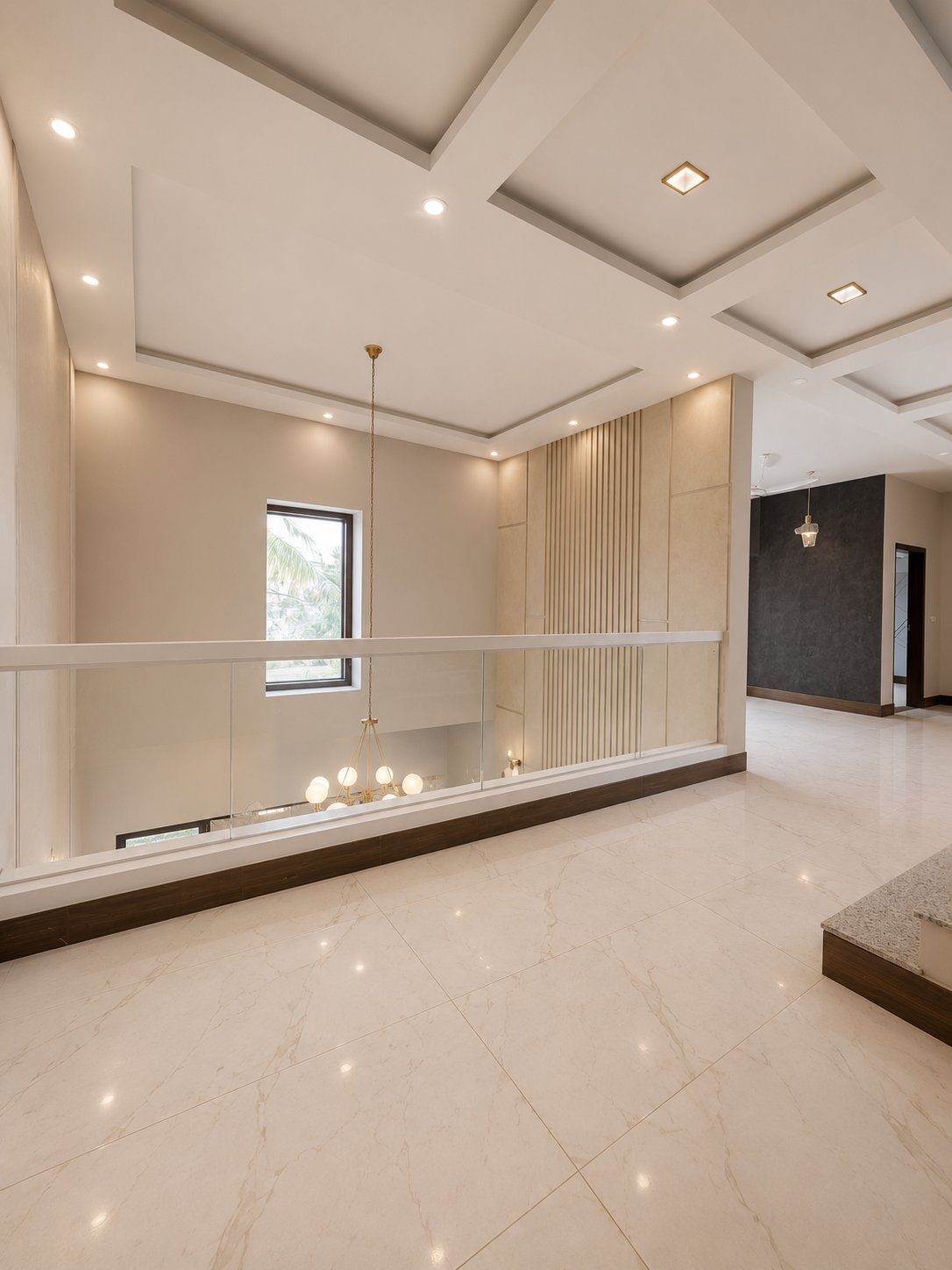 Double height landing with chandelier and marble flooring