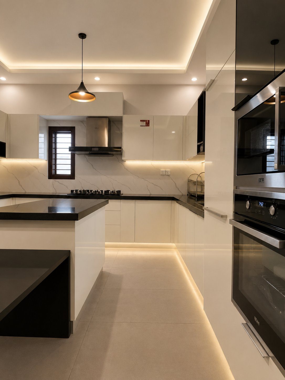 Modern kitchen with marble backsplash and black countertops